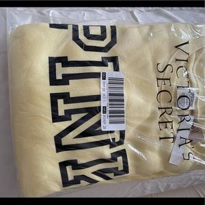 Yellow Victoria’s Secret Pink sweater.